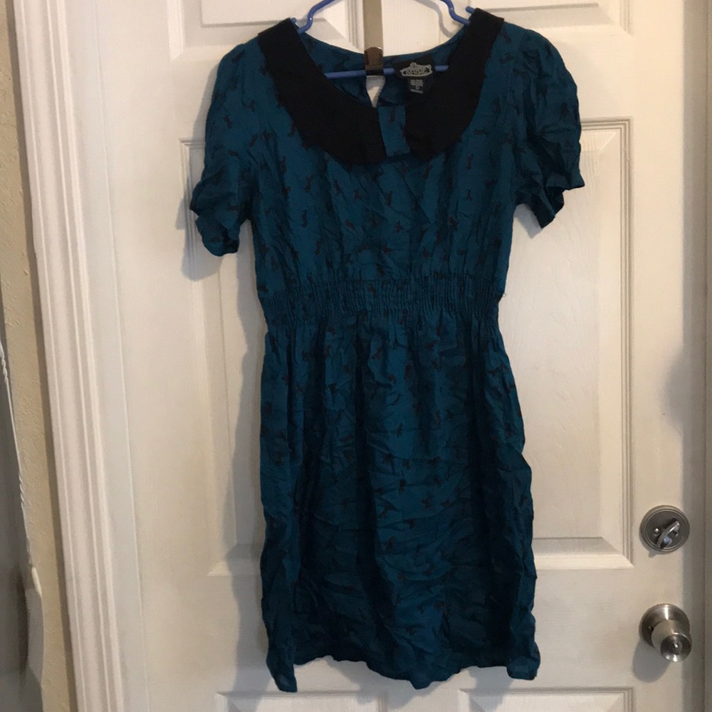 Turquoise colored dress.